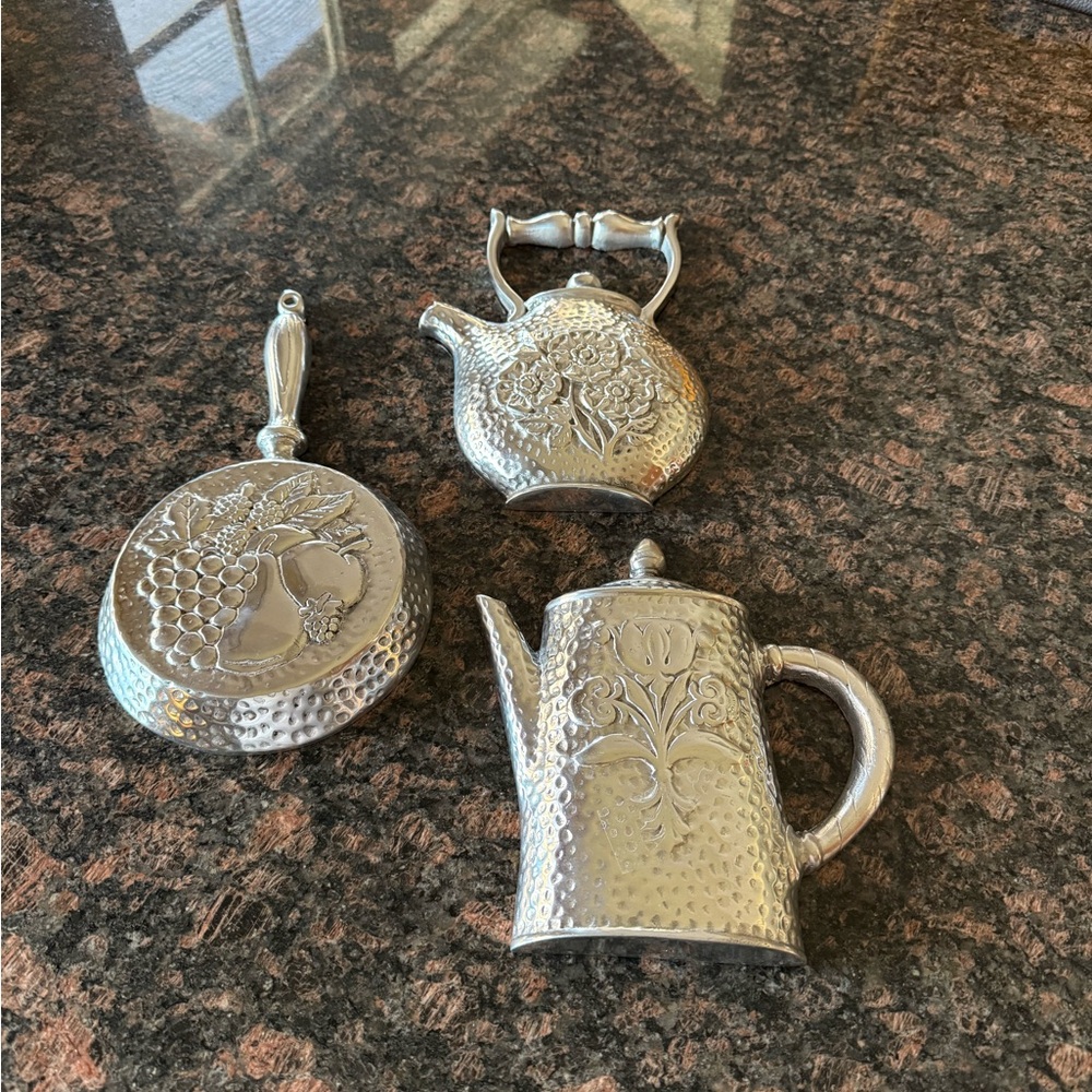 Pewter art deco farmhouse vintage wall hangings. Skillet, coffee and tea pot